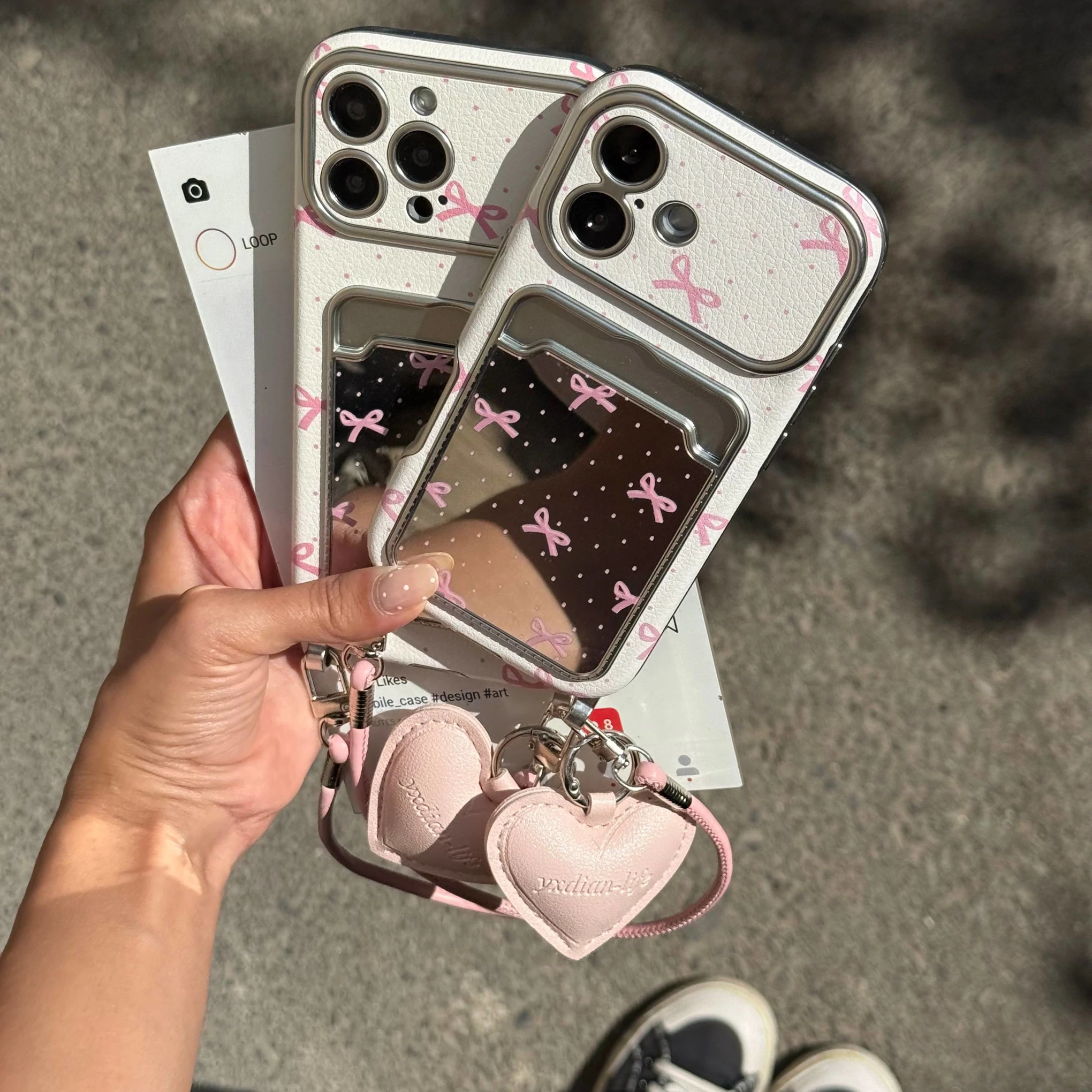 قاب گوشی کلاسیکارد پاپیون آیینه ای صورتی به همراه آویز و چارم قلبی (Classicard Bowtie Mirror Pinky) (LP237)