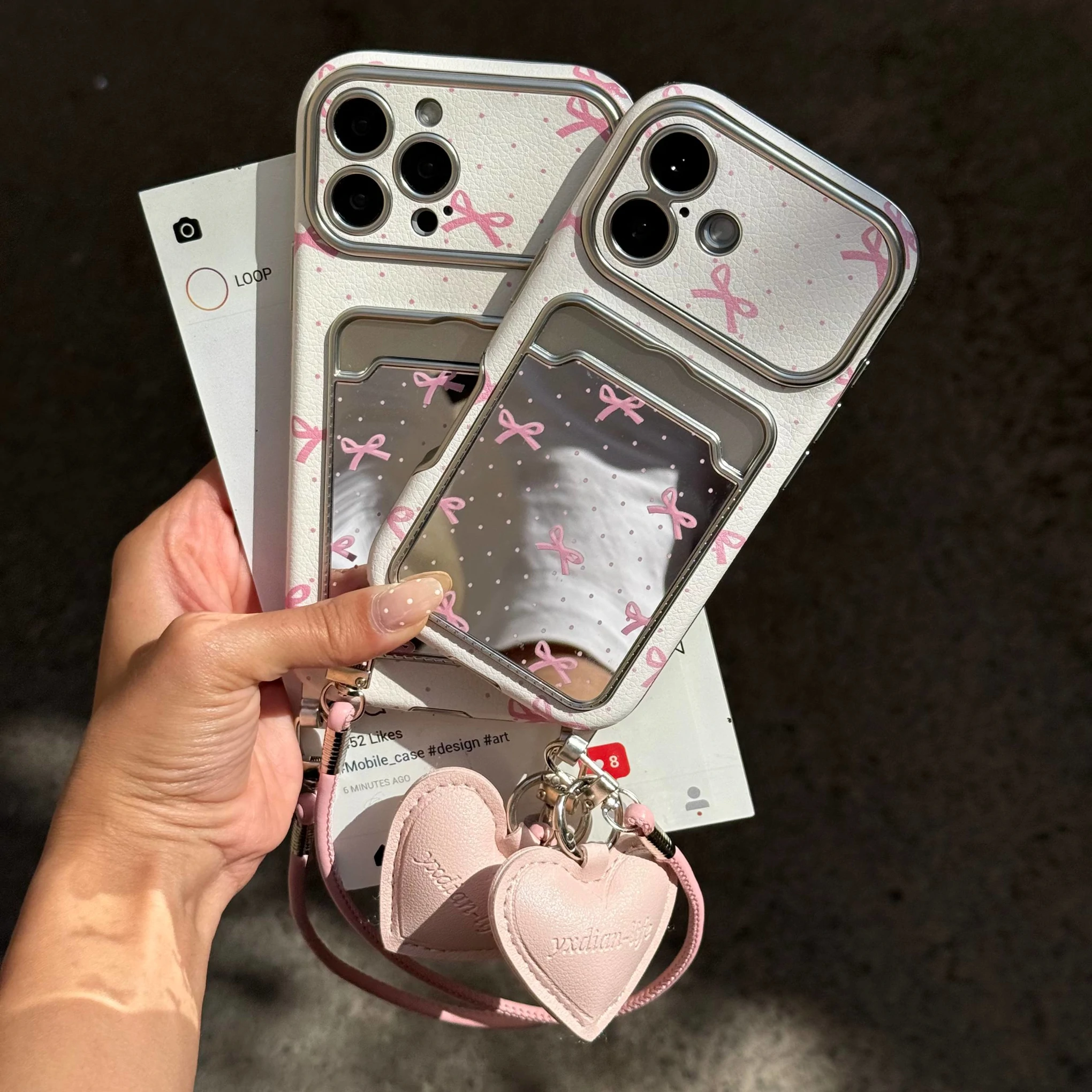 قاب گوشی کلاسیکارد پاپیون آیینه ای صورتی به همراه آویز و چارم قلبی (Classicard Bowtie Mirror Pinky) (LP237)