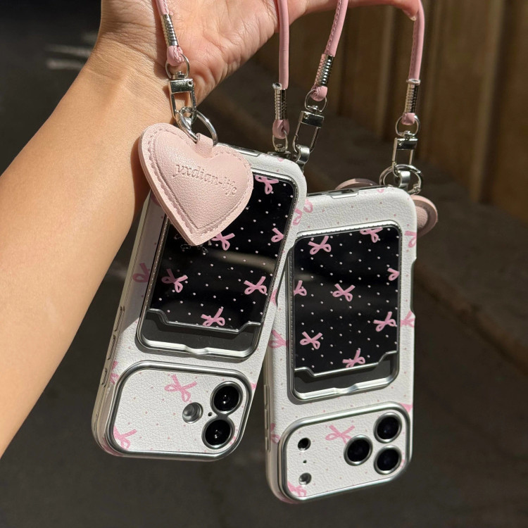 قاب گوشی کلاسیکارد پاپیون آیینه ای صورتی به همراه آویز و چارم قلبی (Classicard Bowtie Mirror Pinky) (LP237)